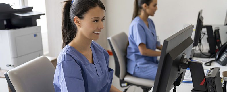 Nurses analyze patient data in EHR Software platform