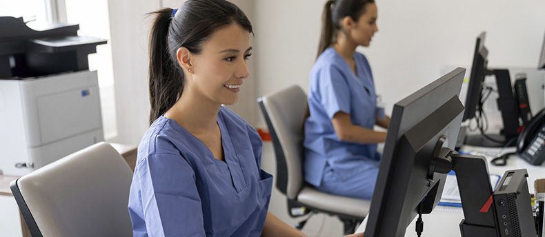 Nurses analyze patient data in EHR Software platform