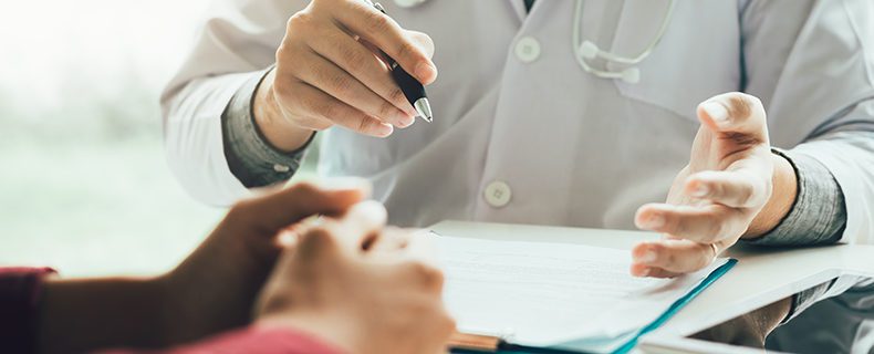 Doctor works on point of care documentation